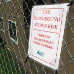 A sign warning of cars going through Chicken Yard Park is pictured on Tuesday, Aug. 7, 2018. The Parks and Recreation department posted the signs this summer. (Alex McCarthy | Juneau Empire)