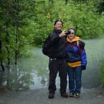 Steve and JoAnne Zemanek, from Dayton, Ohio, pose for selfie at a flooded impass on Nugget Falls Trail. Flooding on the Mendenhall River and lake is expected to peak today. (Kevin Gullufsen | Juneau Empire)