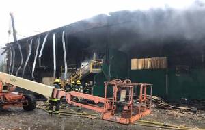 Capital City Fire/Rescue firefighters work to secure a former Waste Management recycling building that caught fire on Aug. 9, 2018. The building was already being demolished when the fire happened, CCFR officials said (Courtesy Photo | Capital City Fire/Rescue)