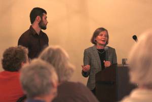 Eva Bornstein, program officer for the Juneau Economic Development Council, speaks at the Juneau Chamber of Commerce Luncheon at the Moose Lodge on Thursday, Aug. 9, 2018 alongside JEDC intern Gunnar Schultz. (Alex McCarthy | Juneau Empire)
