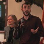 Gunnar Schultz, intern for the Juneau Economic Development Council, speaks at the Juneau Chamber of Commerce Luncheon at the Moose Lodge on Thursday, Aug. 9, 2018 alongside JEDC Program Officer Eva Bornstein. (Alex McCarthy | Juneau Empire)