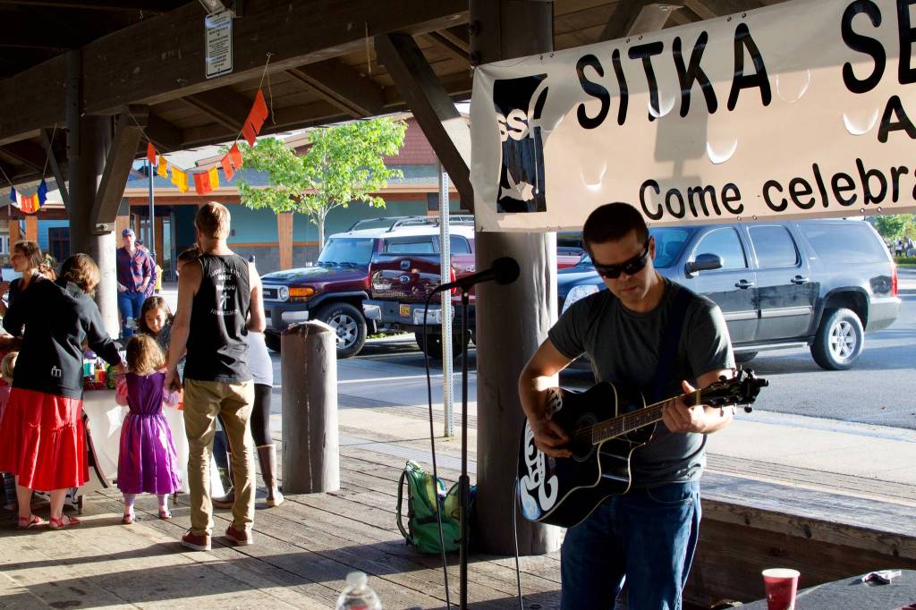 Mark Sixbey plays during the Wild Salmon Day Block Party. (Maia Mares | For the Capital City Weekly)