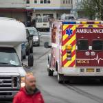 A Capital City Fire/Rescue crew transports a cruise ship passenger off the Radiences of the Seas downtown on Tuesday, August 14, 2018. (Michael Penn | Juneau Empire)