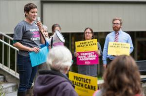 Alyson Currey, of Planned Parenthood Votes Northwest and Hawaii, speaks to abortion rights supporters at the Dimond Courthouse Plaza on Wednesday, August 15, 2018,during a protest against President Donald Trumps selection of Judge Brett Kavanaugh to become an Associate Justice of the Supreme Court of the United States. (Michael Penn | Juneau Empire)