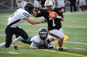 Wests Lewis Malala fights off Juneaus Lewis Mojica and Hansel Hinckle. (Michael Dinneen | For the Juneau Empire)