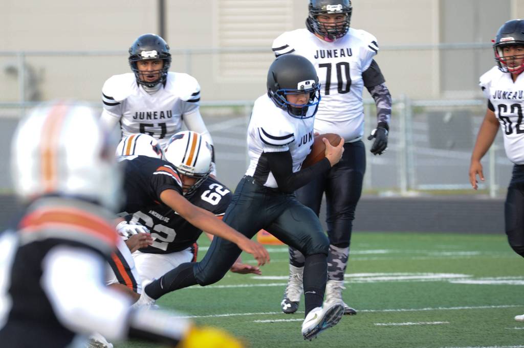 Juneaus Thomas Willhoite finds a hole in the West defense. (Michael Dinneen | For the Juneau Empire)