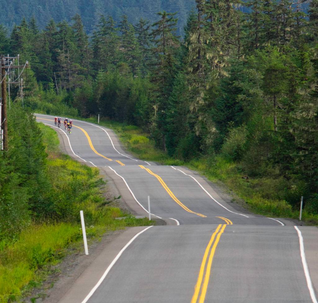 A group of cyclists start the 4.5 mile race up Eaglecrest Road on Saturday. (Richard McGrail | Juneau Empire)