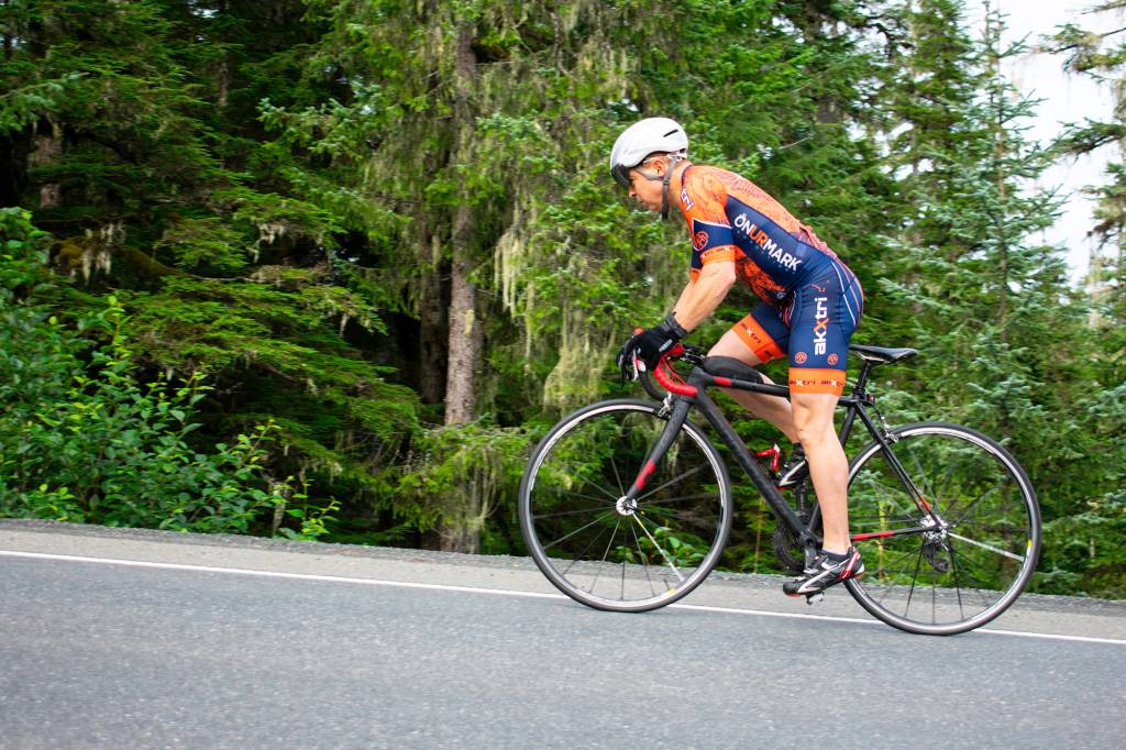 Daren Booton charges up a hill during a steep portion of Eaglecrest Road on Saturday. (Richard McGrail | Juneau Empire)