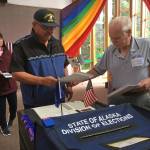 Rob Edwardson, Democratic candidate for House District 34, casts his ballot Tuesday, Aug. 21, 2018 at Aldersgate United Methodist Church. At background is Edwardsons wife, Sandy. (James Brooks | Juneau Empire)