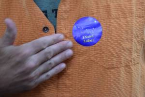 Jerry Nankervis, Republican candidate for House District 34, puts on his I Voted sticker after casting his ballot on Tuesday, Aug. 21, 2018 in Alaskas statewide primary election. (James Brooks | Juneau Empire)