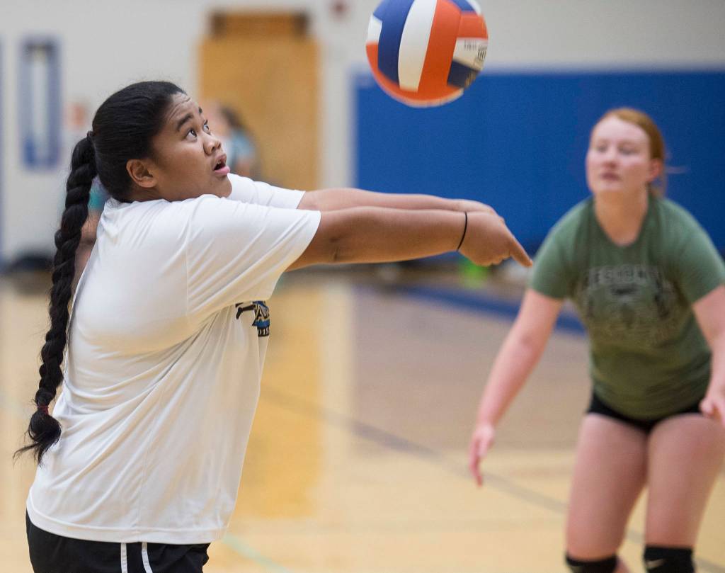 Marissa Tanuvasa Tuvaifale bumps the ball up during Thunder Mountain High School varsity volleyball practice at TMHS on Wednesday, August 15, 2018. (Michael Penn | Juneau Empire)