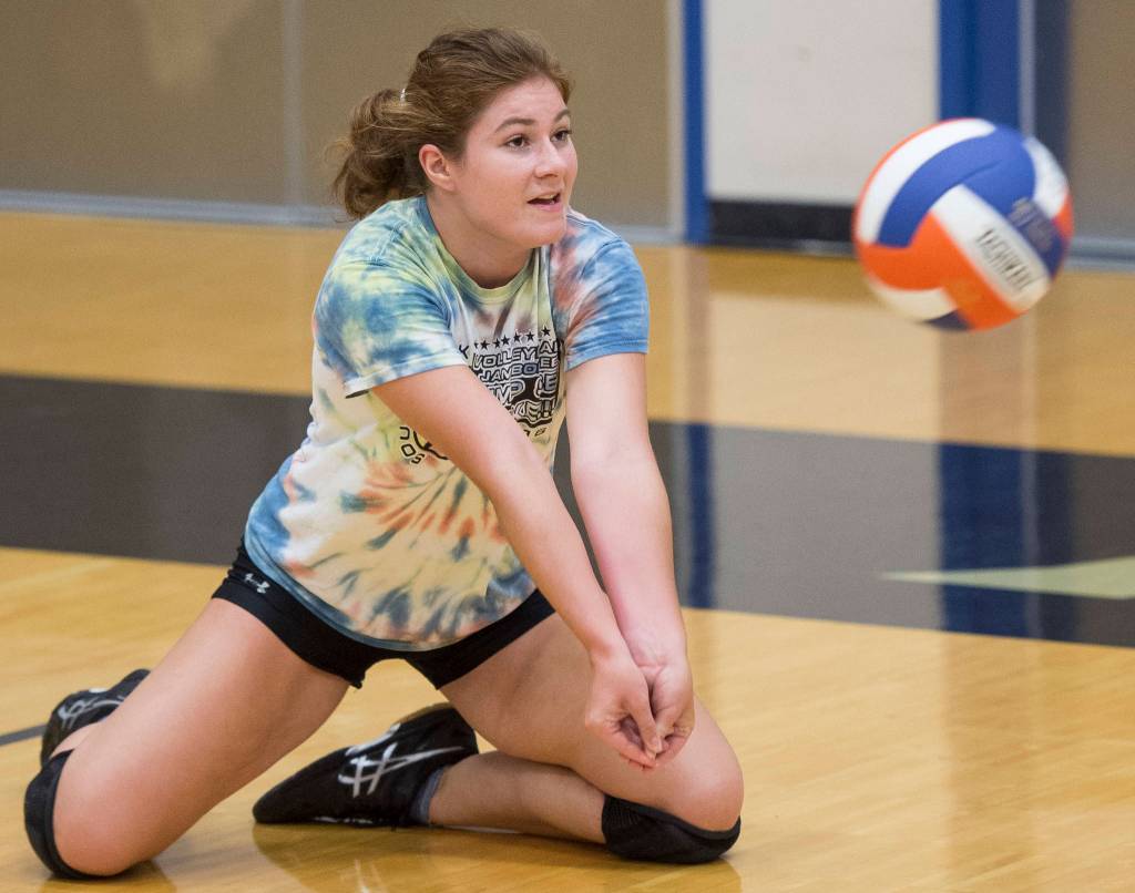 Senior Kiley Stevens bumps the ball up during Thunder Mountain High School varsity volleyball practice at TMHS on Wednesday, August 15, 2018. (Michael Penn | Juneau Empire)
