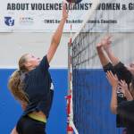 Sophomore Lilyan Smith taps the ball over during Thunder Mountain High School varsity volleyball practice at TMHS on Wednesday, August 15, 2018. (Michael Penn | Juneau Empire)