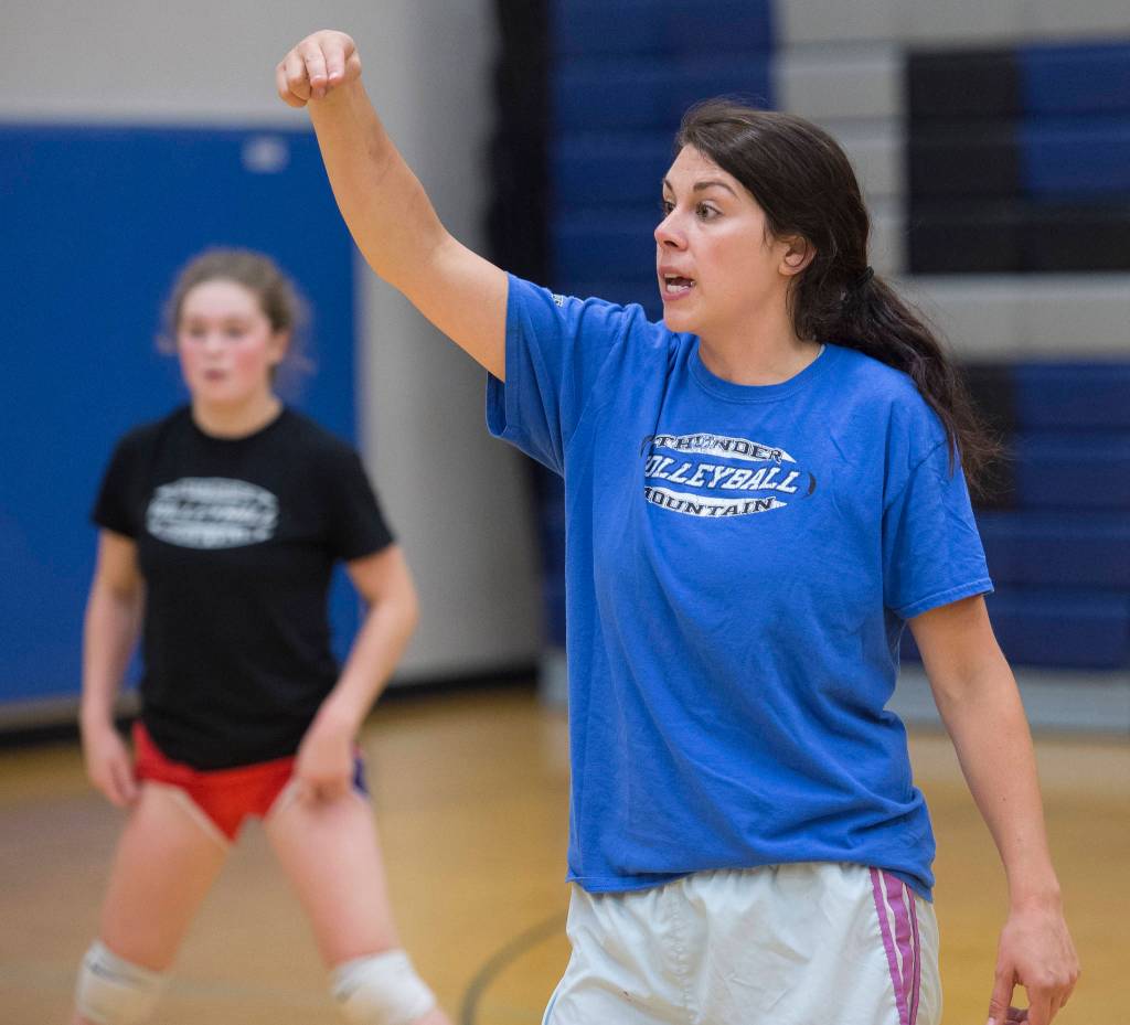 Coach Julie Herman leads her team during Thunder Mountain High School varsity volleyball practice at TMHS on Wednesday, August 15, 2018. (Michael Penn | Juneau Empire)