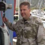 James McKnight holds a coho salmon he caught on Saturday, Aug. 18, 2018 at the Golden North Salmon Derby. The fish, weighed at 17.7 pounds, was the largest one caught at the derby. (Courtesy Photo | Derby Committee)