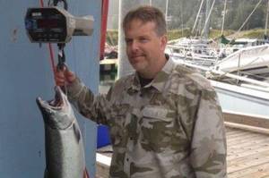 James McKnight holds a coho salmon he caught on Saturday, Aug. 18, 2018 at the Golden North Salmon Derby. The fish, weighed at 17.7 pounds, was the largest one caught at the derby. (Courtesy Photo | Derby Committee)