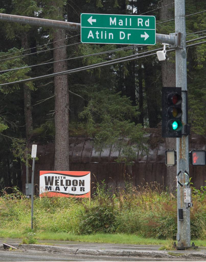 A Beth Weldon election sign on Mendenhall Loop Road on Friday, Aug. 24, 2018. Alaska statute states signs on private or commercial property cannot be located within 660 feet of a state-maintained road or with the purpose of their message being read from the main traveled way. (Michael Penn | Juneau Empire)