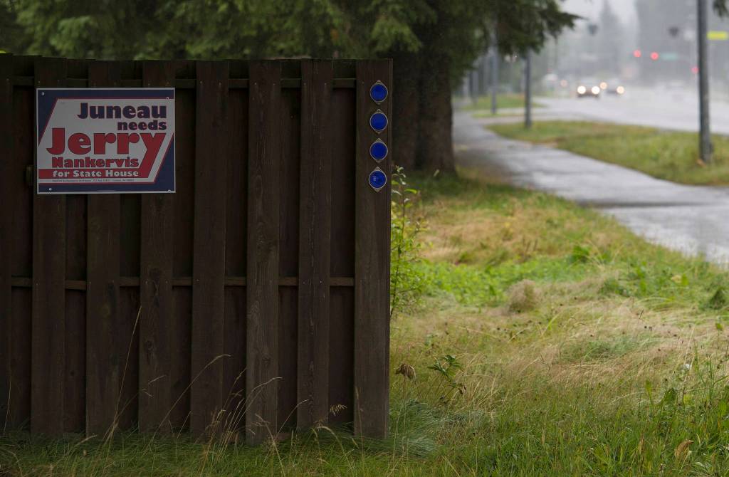 A Jerry Nankervis for state house election sign on Mendenhall Loop Road on Friday, Aug. 24, 2018. Alaska statute states signs on private or commercial property cannot be located within 660 feet of a state-maintained road or with the purpose of their message being read from the main traveled way. (Michael Penn | Juneau Empire)