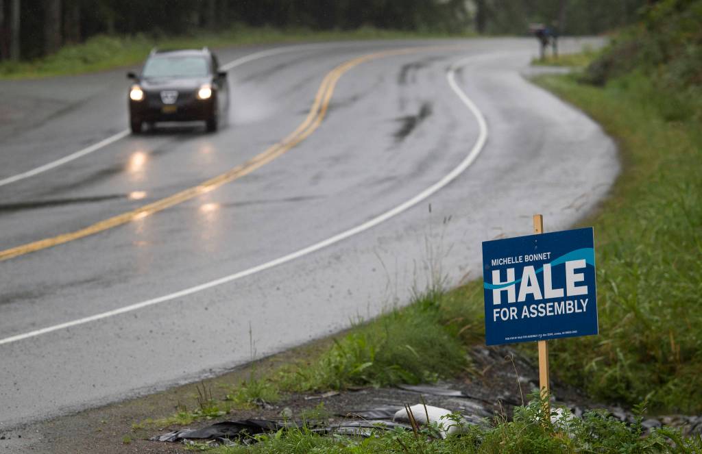 A Michelle Bonnet Hale for assembly election sign on Mendenhall Loop Road on Friday, Aug. 24, 2018. Alaska statute states signs on private or commercial property cannot be located within 660 feet of a state-maintained road or with the purpose of their message being read from the main traveled way. (Michael Penn | Juneau Empire)