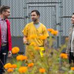 Jeremy Bauer, left, and Jason Clifton, right, of Frenchies Floral Studio, talk with inmate Patrick Sweeney about a flower-growing collaboration at Lemon Creek Correctional Center on Friday, Aug. 24, 2018. (Michael Penn | Juneau Empire)