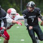 Juneau Footballs Cooper Kriegmont is sacked by Easts Daryl Delaguion at Adair-Kennedy Memorial Field on Saturday, Aug. 25, 2018. East won 40-0. (Michael Penn | Juneau Empire)