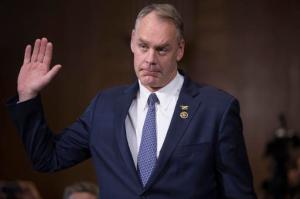 Interior Secretary-designate, Rep. Ryan Zinke, R-Mont., is sworn in on Capitol Hill in Washington, Tuesday, Jan. 17, 2017, prior to testifying at his confirmation hearing before the Senate Energy and Natural Resources Committee. Zinke, 55, a former Navy SEAL who just won his second term in Congress, was an early supporter of President-elect Donald Trump and, like his prospective boss, has expressed skepticism about the urgency of climate change.