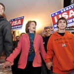 This Nov. 2, 2010 file photo shows U.S. Sen. Lisa Murkowski, R-Alaska, walking to Election Central in Anchorage with her sons Nick, left, and Matt. The election night tradition in Alaska of candidates of all parties milling about at Election Central awaiting election results or going there for media interviews has ended.