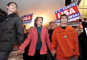 This Nov. 2, 2010 file photo shows U.S. Sen. Lisa Murkowski, R-Alaska, walking to Election Central in Anchorage with her sons Nick, left, and Matt. The election night tradition in Alaska of candidates of all parties milling about at Election Central awaiting election results or going there for media interviews has ended.