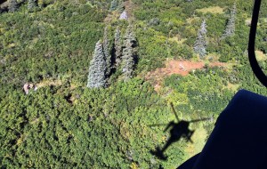 This Wednesday Aug. 31 photo provided by Alaska State Troopers shows the wreckage of a Cessna 208 Caravan, strewn from the bare earth at right to the left center, involved in a deadly midair collision with another small plane over a remote area near the village of Russian Mission in western Alaska. A total of five people died in the Wednesday morning crash. Rough terrain complicated efforts to recover the bodies of the four Alaskans and a Montana man who died.