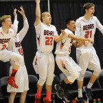 Juneau’s bench erupts at Kaleb Tompkins’ winning shot at the buzzer against Ketchikan.