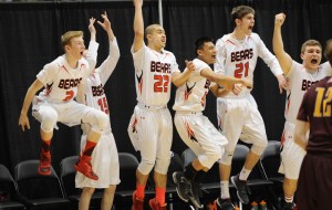 Juneau’s bench erupts at Kaleb Tompkins’ winning shot at the buzzer against Ketchikan.