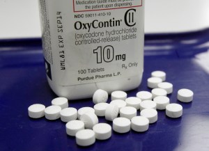 This Feb. 19, 2013, file photo shows OxyContin pills arranged for a photo at a pharmacy in Montpelier, Vt. More than 28,000 Americans died from overdosing on opiates in 2014, a record high for the nation. That’s 78 people per day, a number that doesn’t include the millions of family members, first responders and even taxpayers who feel the ripple of drug addiction in their daily lives. A rise in prescription painkillers is partially to blame: The sale of these drugs has quadrupled since 1999, and so has the number of Americans dying from an addiction to them. When prescriptions run out, people find themselves turning to the cheaper alternative heroin and, increasingly, the even more deadly drug fentanyl.