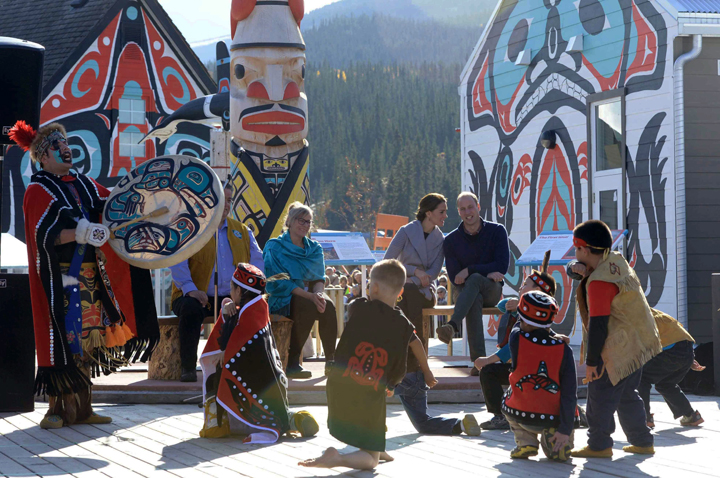 Britain's Prince William and his wife Kate, the Duke and Duchess of Cambridge, watch native youth dancers perform during a welcoming ceremony in Carcross, Yukon, Wednesday.