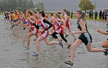 The 1A/2A/3A girls run at the start of the Region V championships on Saturday at Sandy Beach.