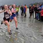 Ketchikan's Sydney Nichols edges out Thunder Mountain's Veronica Salter at the finish of the 4A Girls Region V Crosscountry Championships at Sandy Beach.