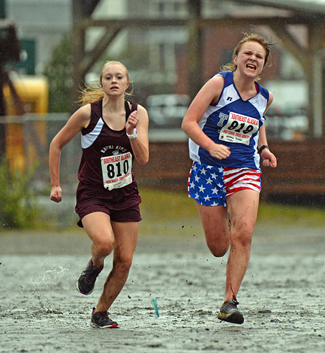 Ketchikan's Sydney Nichols and Thunder Mountain's Veronica Salter sprint to the finish of the 4A Girls Region V championship race on Saturday at Sandy Beach.