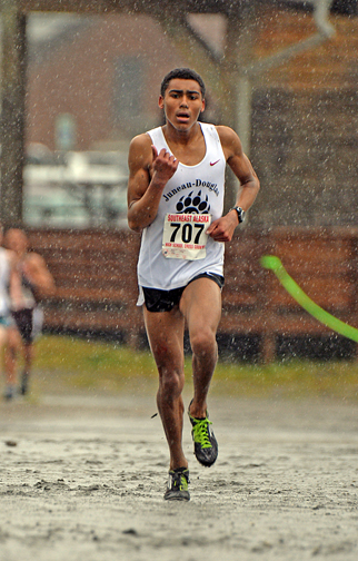 Juneau-Douglas senior Alize Arthur wins the Region V 4A boys cross country championship on Saturday at Sandy Beach.