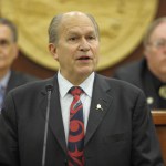 Gov. Bill Walker speaks to a Joint Session of the Alaska Legislature during his annual State of the State address as Senate President Kevin Meyer, R- Anchorage, left, and House Speaker Mike Chenault, R- Nikiski, listen from the front of the House chambers on Thursday.