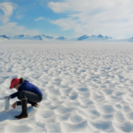 Researcher Sonia Nagorski collects a snow sample on Juneau Icefield