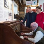 Prince William and his wife Kate, the Duke and Duchess of Cambridge, look on as Doug Bell sends a message at the MacBride Museum of Yukon History in Whitehorse, Yukon, Wednesday.