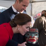 Prince William and his wife Kate, the Duke and Duchess of Cambridge look at a display at a Youth Arts Festival in Whitehorse, Yukon, Wednesday.