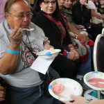 Judge Hilda MacDonald samples the three entries of the Celebration Soapberry Contest at the Juneau Arts & Culture Center Friday.