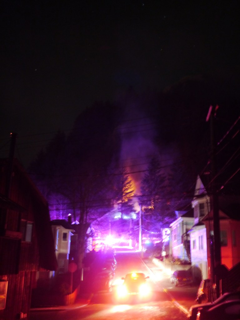 Flames from a duplex fire on Basin Road can be seen early Tuesday morning. (Phillip Moser | For the Juneau Empire)