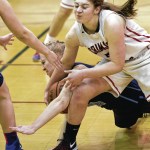 Juneau-Douglas&rsquo; Cassie Dzinich right, and Soldotna&rsquo;s Abby Kruse battle for a loose ball at JDHS on Friday, Feb. 3, 2017. JDHS won 48-46.