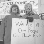 From left, Cathy Botelho and Judith Maier at the &ldquo;Stand with Refugees and Immigrants&rdquo; event Monday, Feb. 6. This was the second gathering organized for 7 - 8:30 a.m. Monday morning in front of the Capitol, aimed both at showing support for refugees and immigrants and thanking Alaskan legislators who have spoken out against President Donald Trump&rsquo;s executive order. (Mary Catharine Martin | Capital City Weekly)