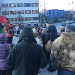 &ldquo;Stand with Refugees and Immigrants&rdquo; event organizers Jill Weitz (with red sign) and Daniel Kirkwood (orange jacket) speak with attendees prior to dispersing around 8:30 a.m. Monday. (Mary Catharine Martin | Juneau Empire)