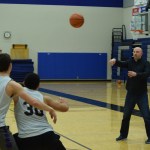 Thunder Mountain high school basketball coach John Blasco lofts a pass to his players during a drill at practice Wednesday, Feb. 8 at TMHS. (Nolin Ainsworth | Juneau Empire)