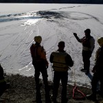 Capital City Fire/Rescue&rsquo;s Noah Jenkins, left, Marcus Kinman, Andrew Bishop, Brady Fink and Chad Gustafson practice ice rescue training at Twin Lakes on Thursday. (Michael Penn | Juneau Empire)
