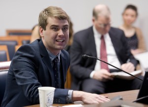 Brian Fechter, policy analyst for the Office of Management and Budget, speaks to House Transportation Committee members Tuesday about HB 60, the motor fuel tax bill. (Michael Penn | Juneau Empire)