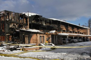 The burned remains of the Royal Suite Lodge in Anchorage are shown Wednesday after an early morning fire. Officials said several were injured in the deadly fire. The fire&rsquo;s cause is under investigation. (Mark Thiessen | The Associated Press)